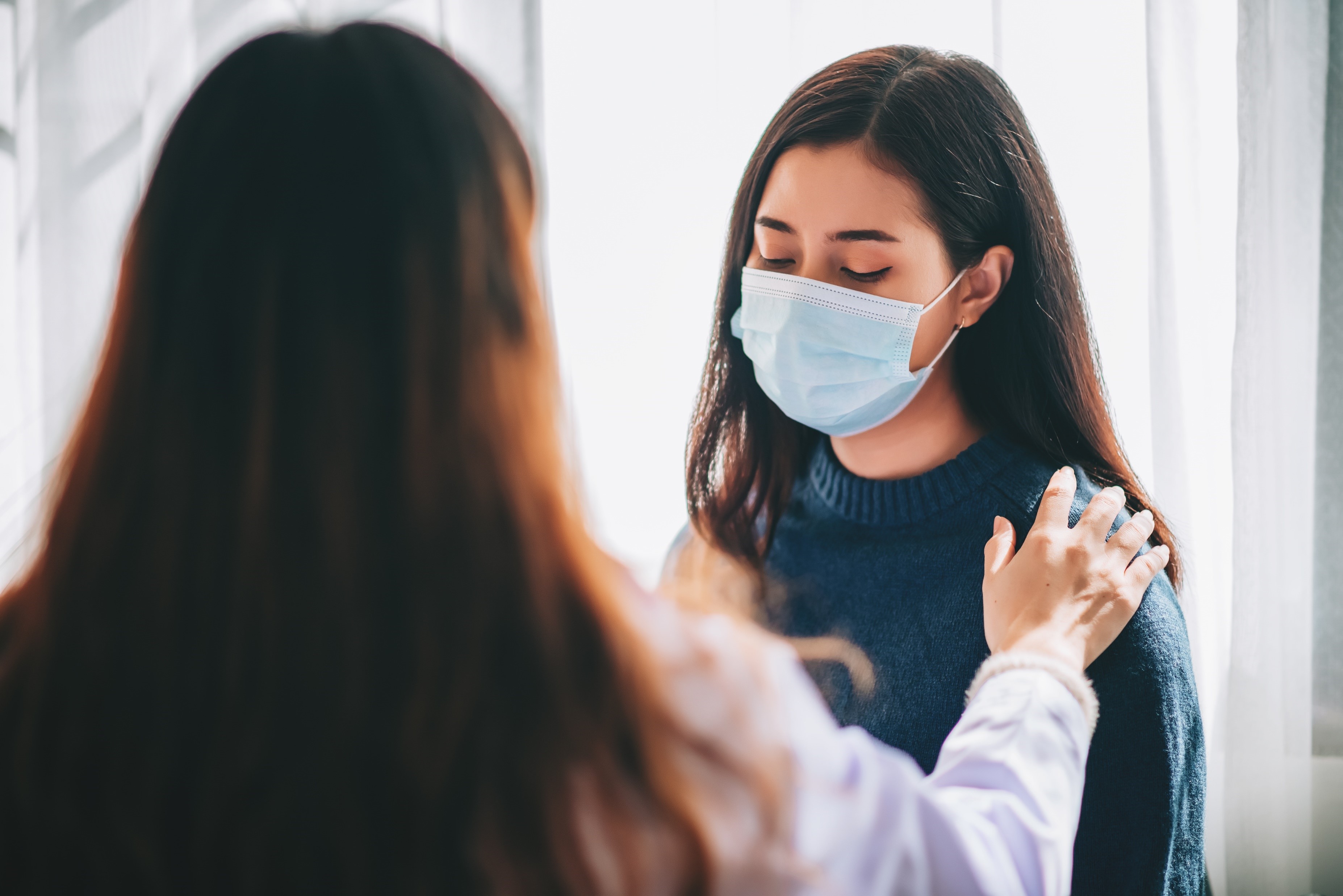 Nurse examines young adult