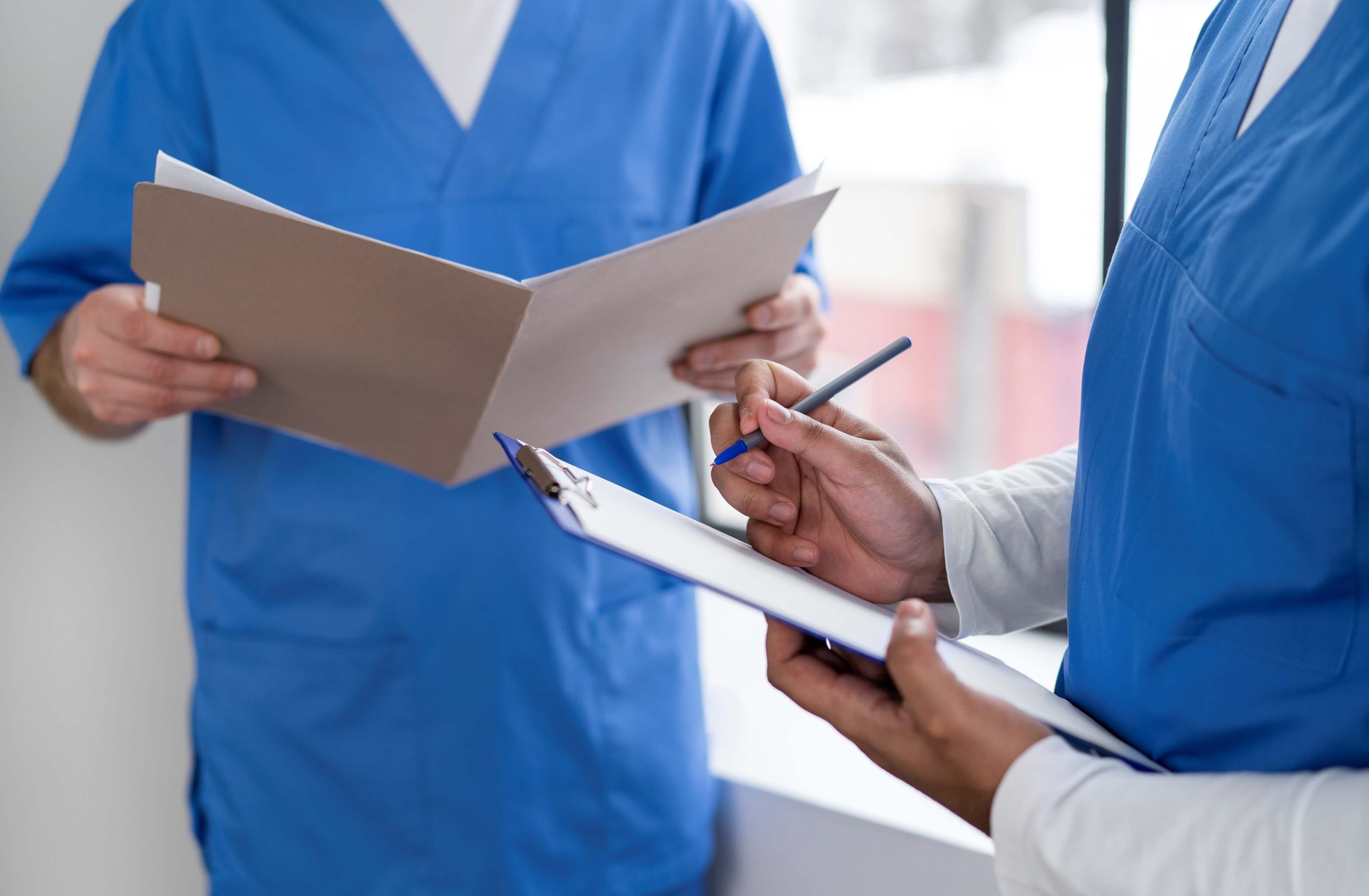 Two Nurses with Patient Record
