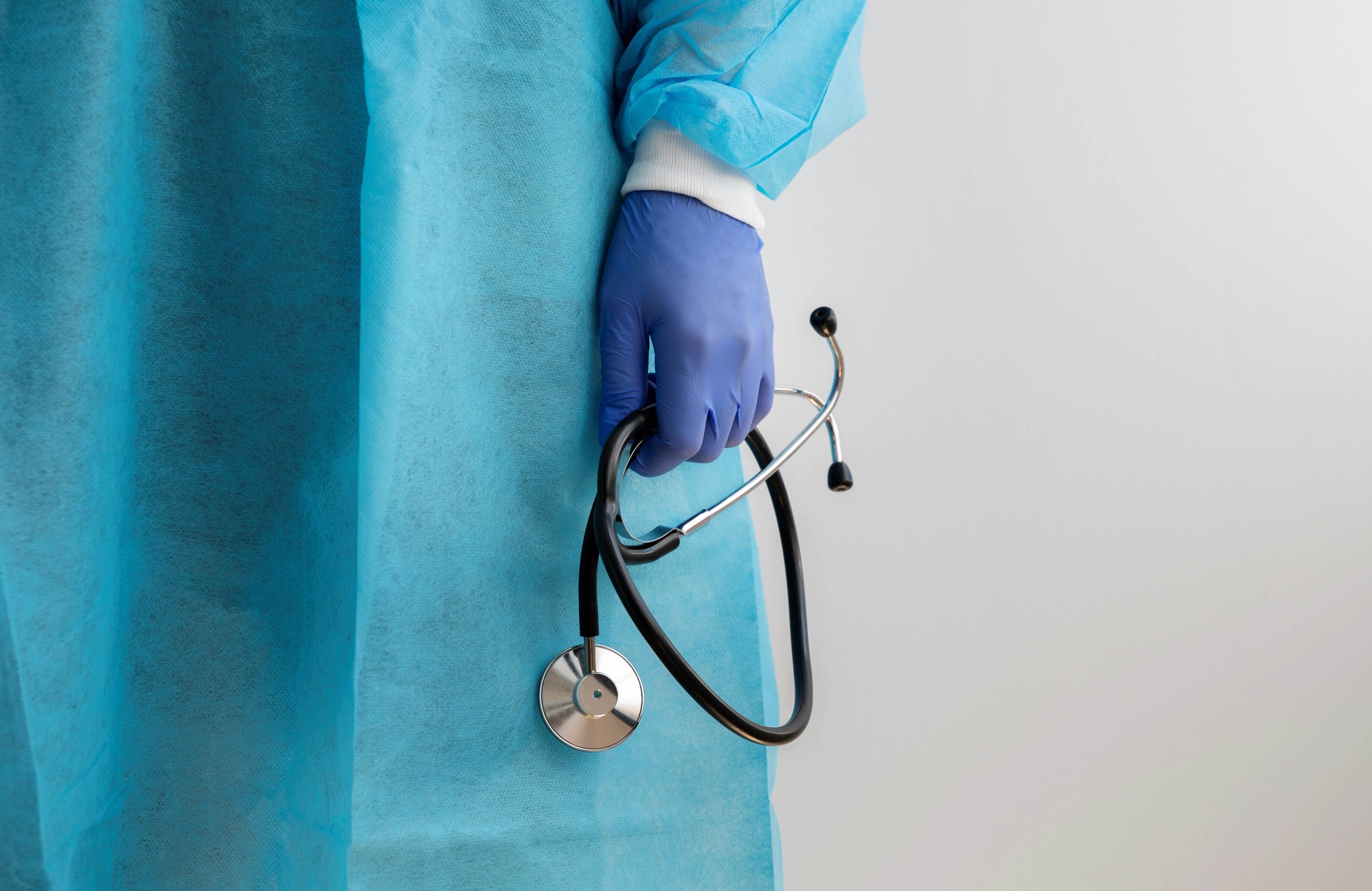 Front view of a nurse holding a stethoscope