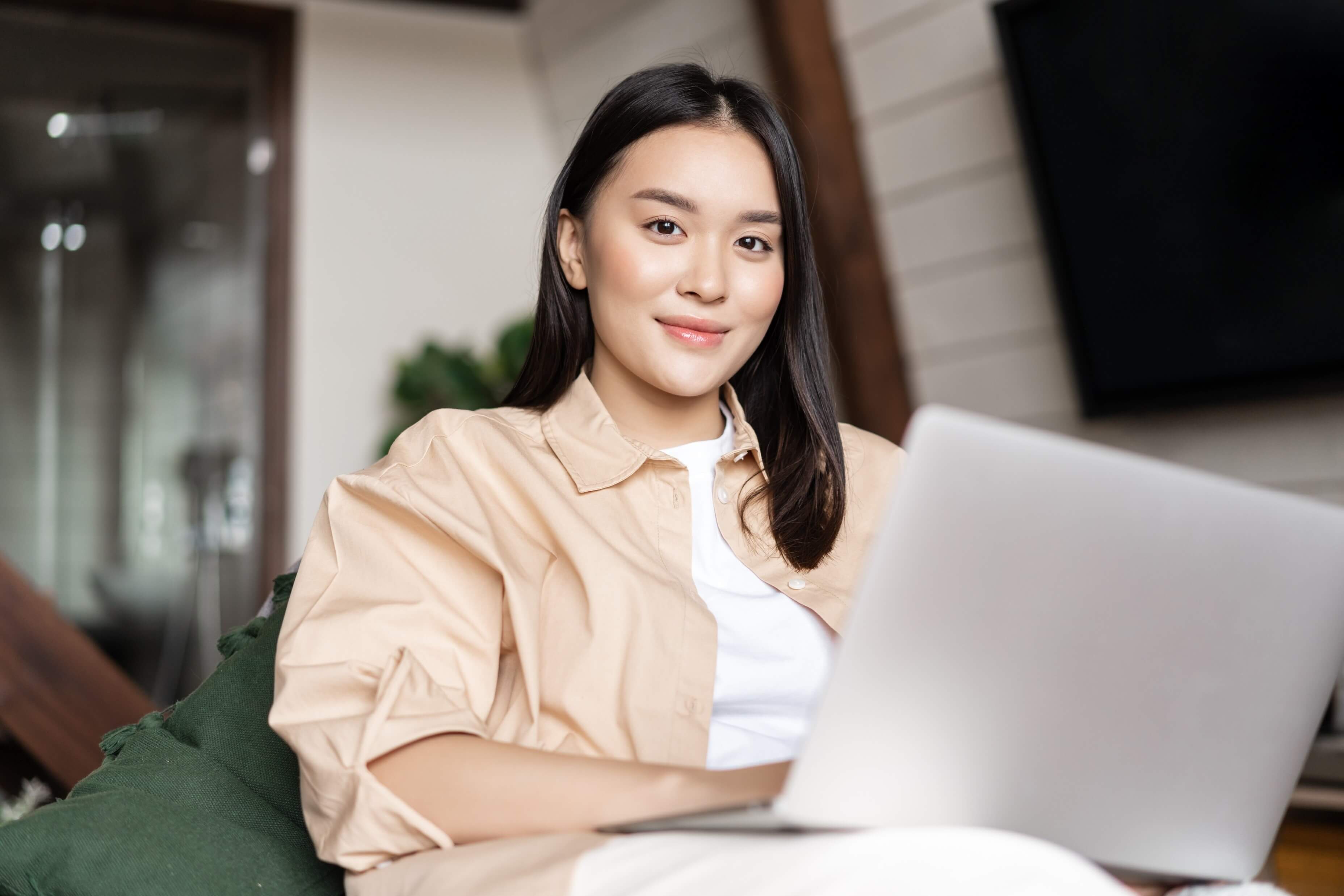 Young asian woman with a laptop