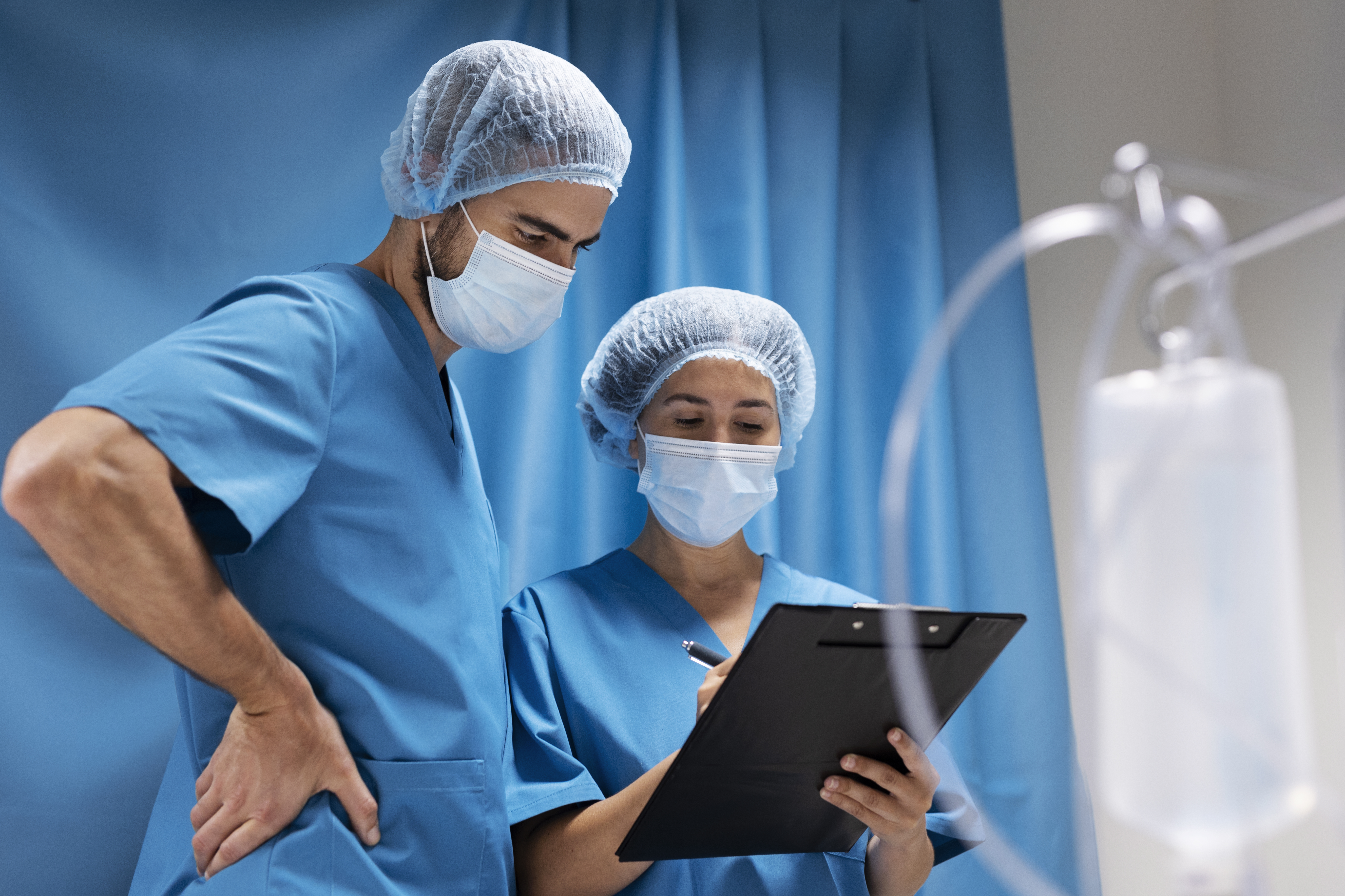 nurse in mask discussing