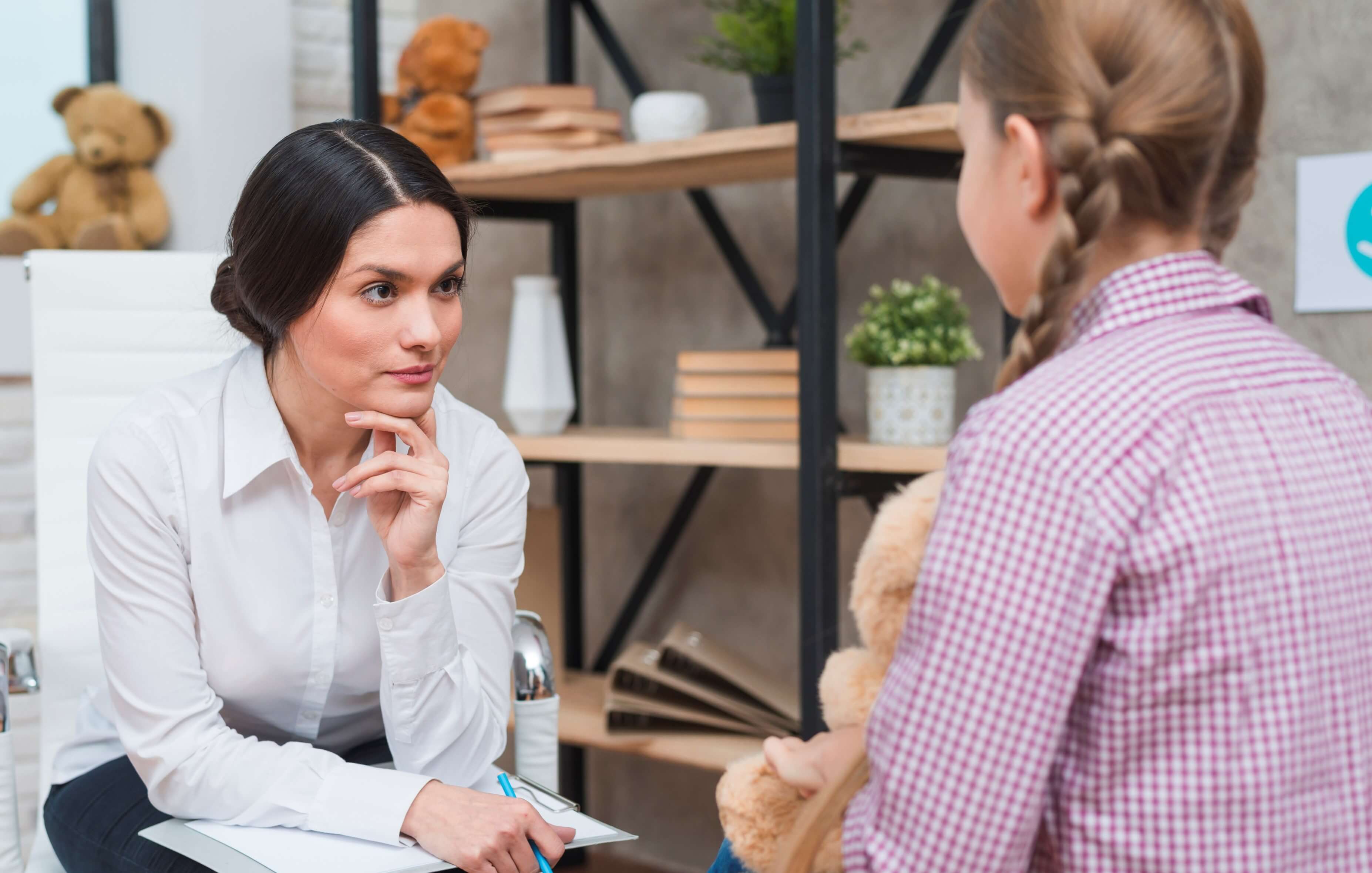Nurse observing a little girl