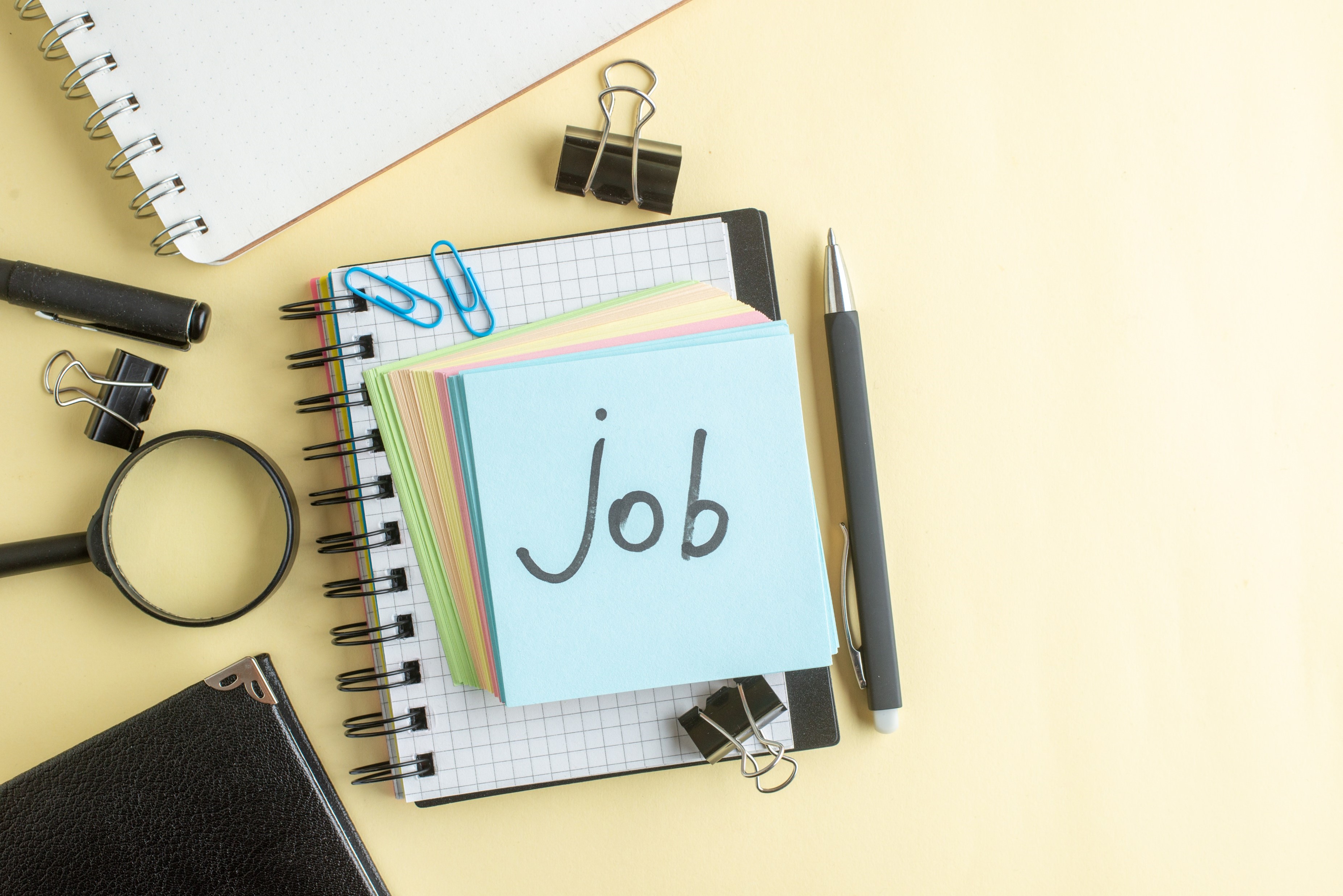 top-view-job-written-note-along-with-colorful-little-paper-notes-light-background-school-office-job-notepad-color-work