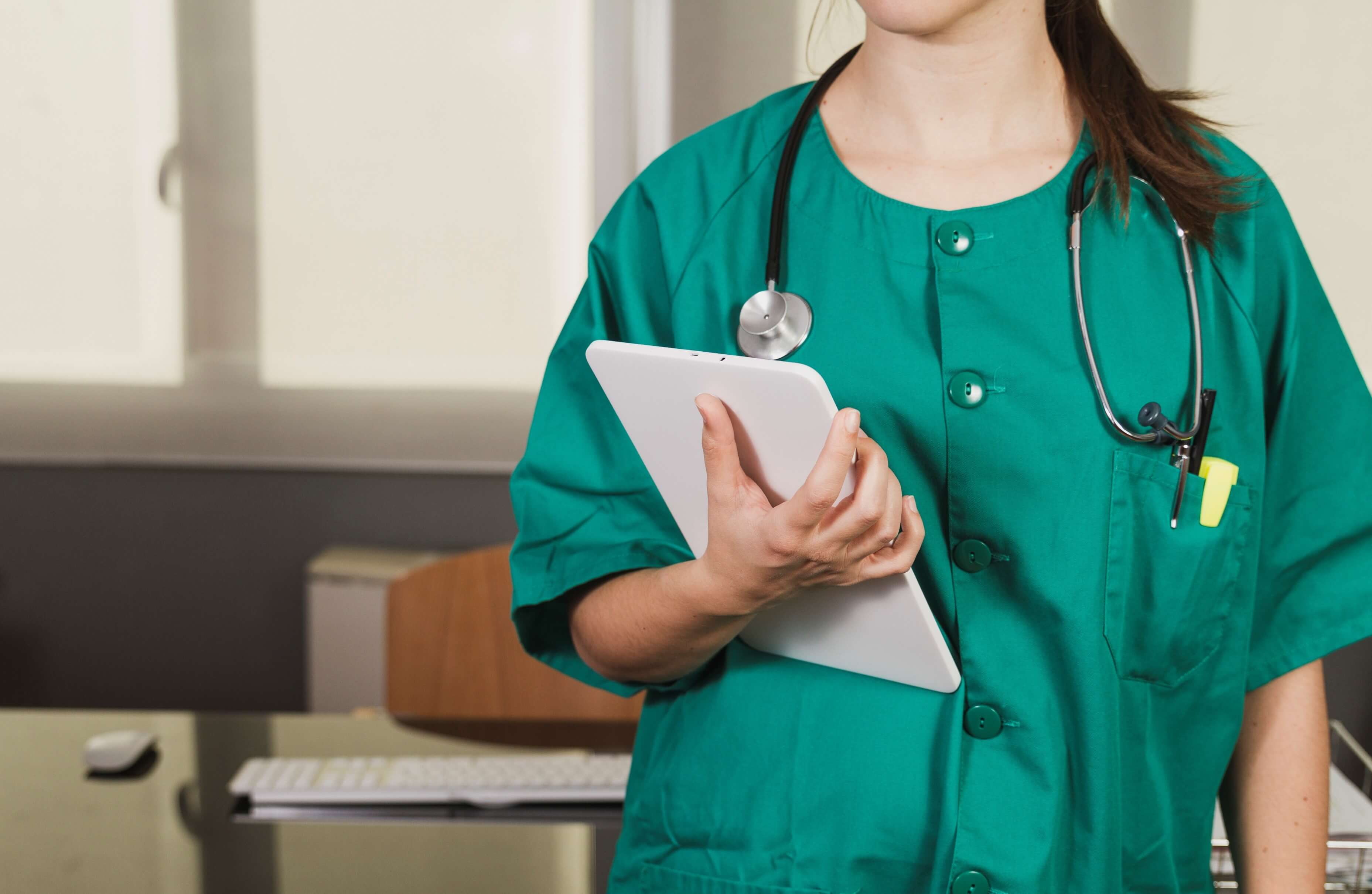 nurse holding a checklist of patient's records