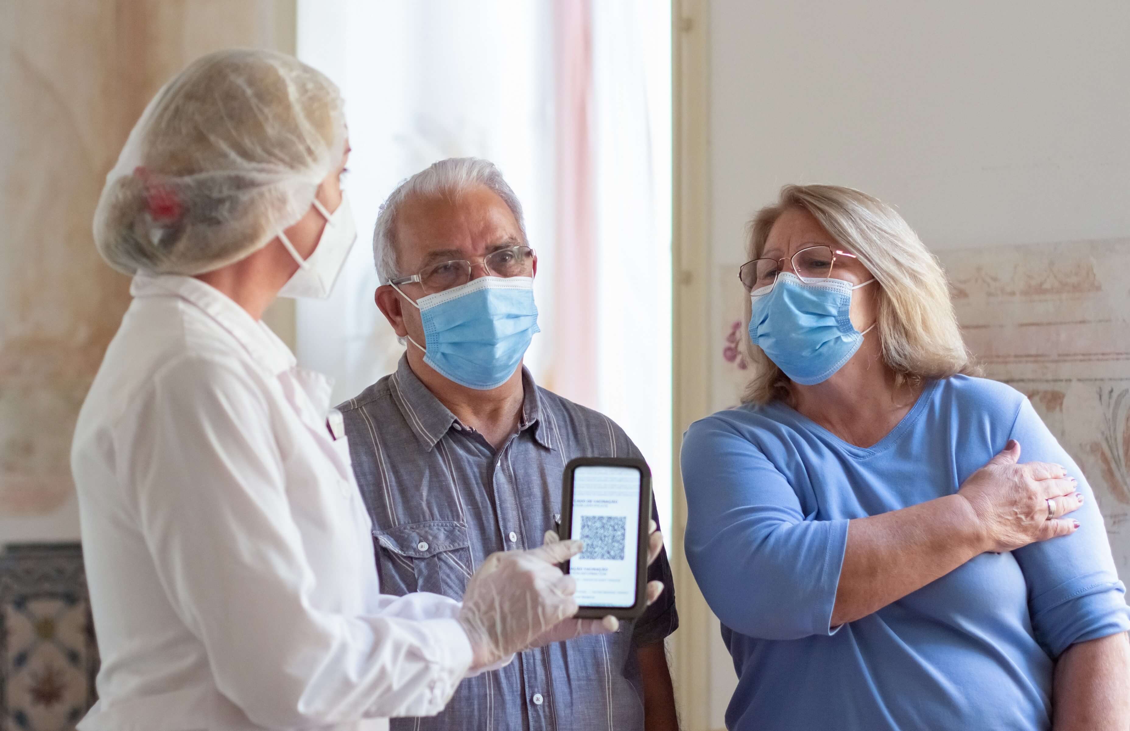 Nurse helping elderly patients